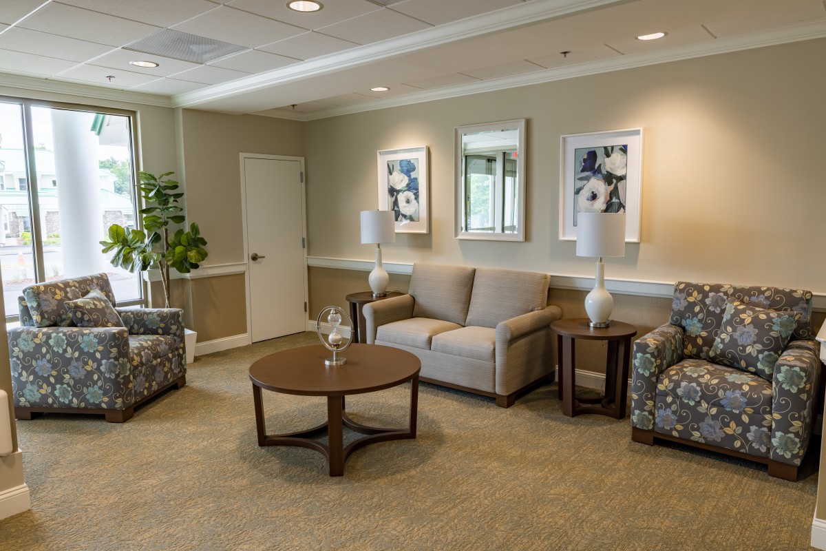 A cozy waiting room with comfortable seating and elegant decor.