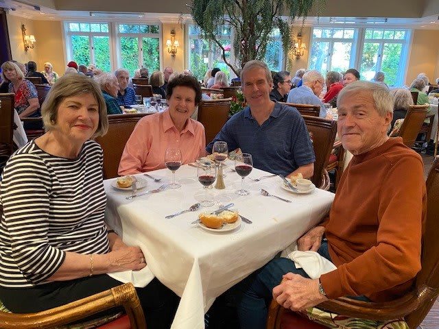 A group of friends enjoying dinner at a restaurant.