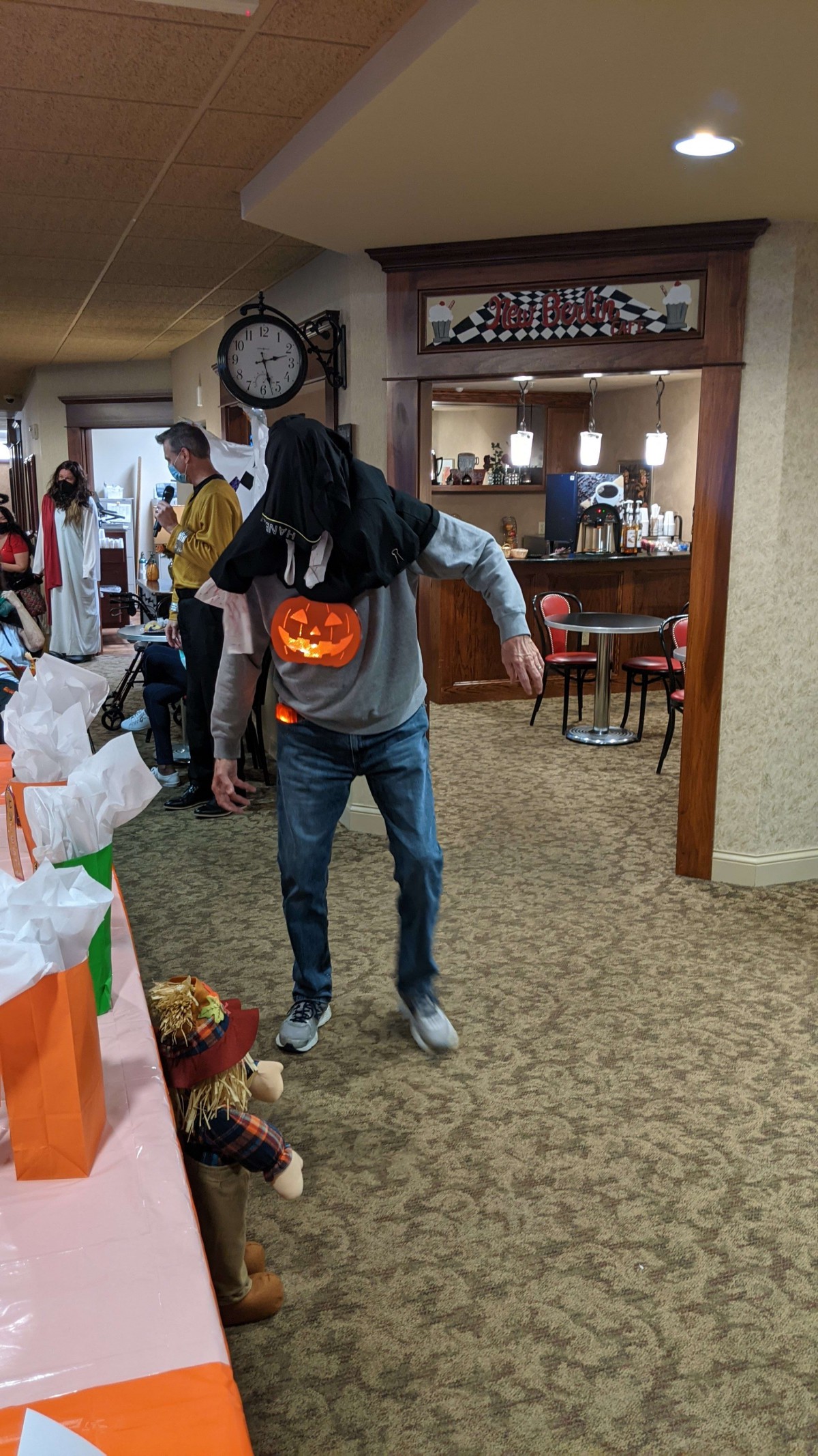 A person wearing a creative Halloween costume at an indoor party.