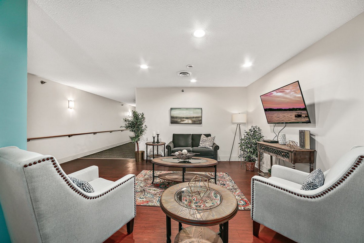 A modern living room with comfortable seating and stylish decor.