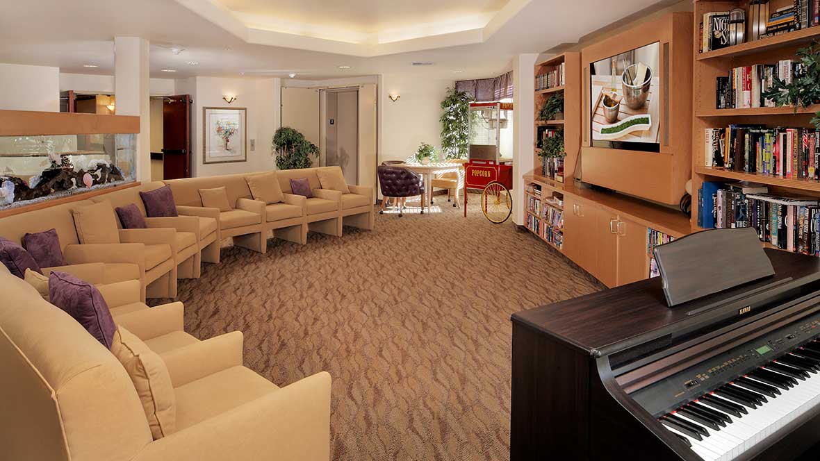 A spacious and modern living room with comfortable seating and a large television.
