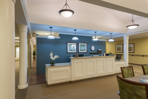 A modern reception area featuring a welcoming desk and stylish lighting.