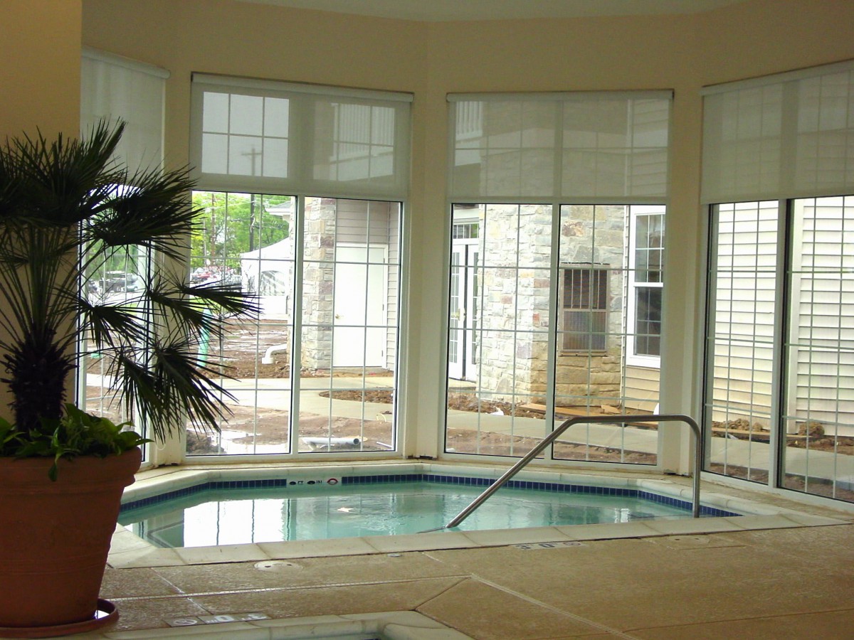A cozy indoor spa with large windows and natural light.