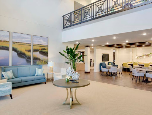 A beautifully designed modern living area featuring comfortable seating and stylish decor.