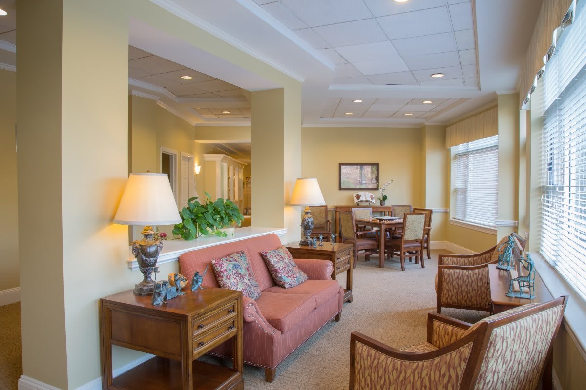 A warm and inviting living room with comfortable seating and a dining area.
