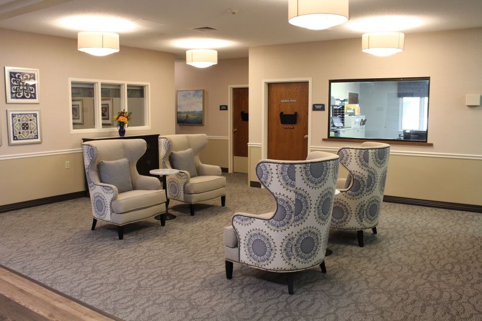 A modern lobby area with stylish seating arrangements and soft lighting.
