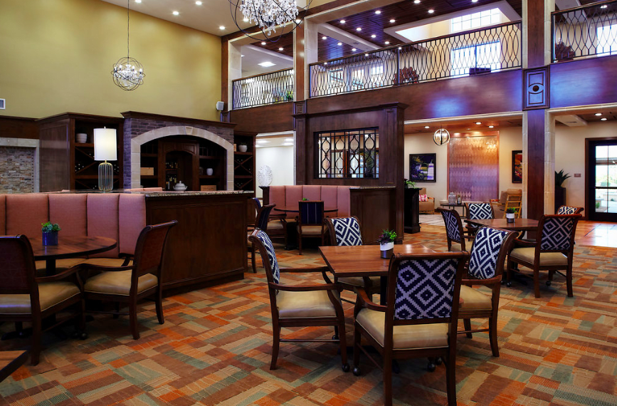 A cozy dining area with elegant furniture and lighting.