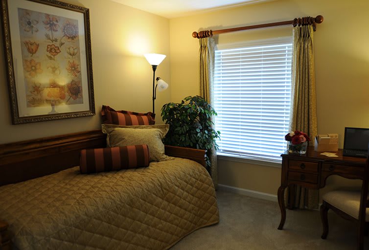 Cozy bedroom with warm lighting and elegant decor.