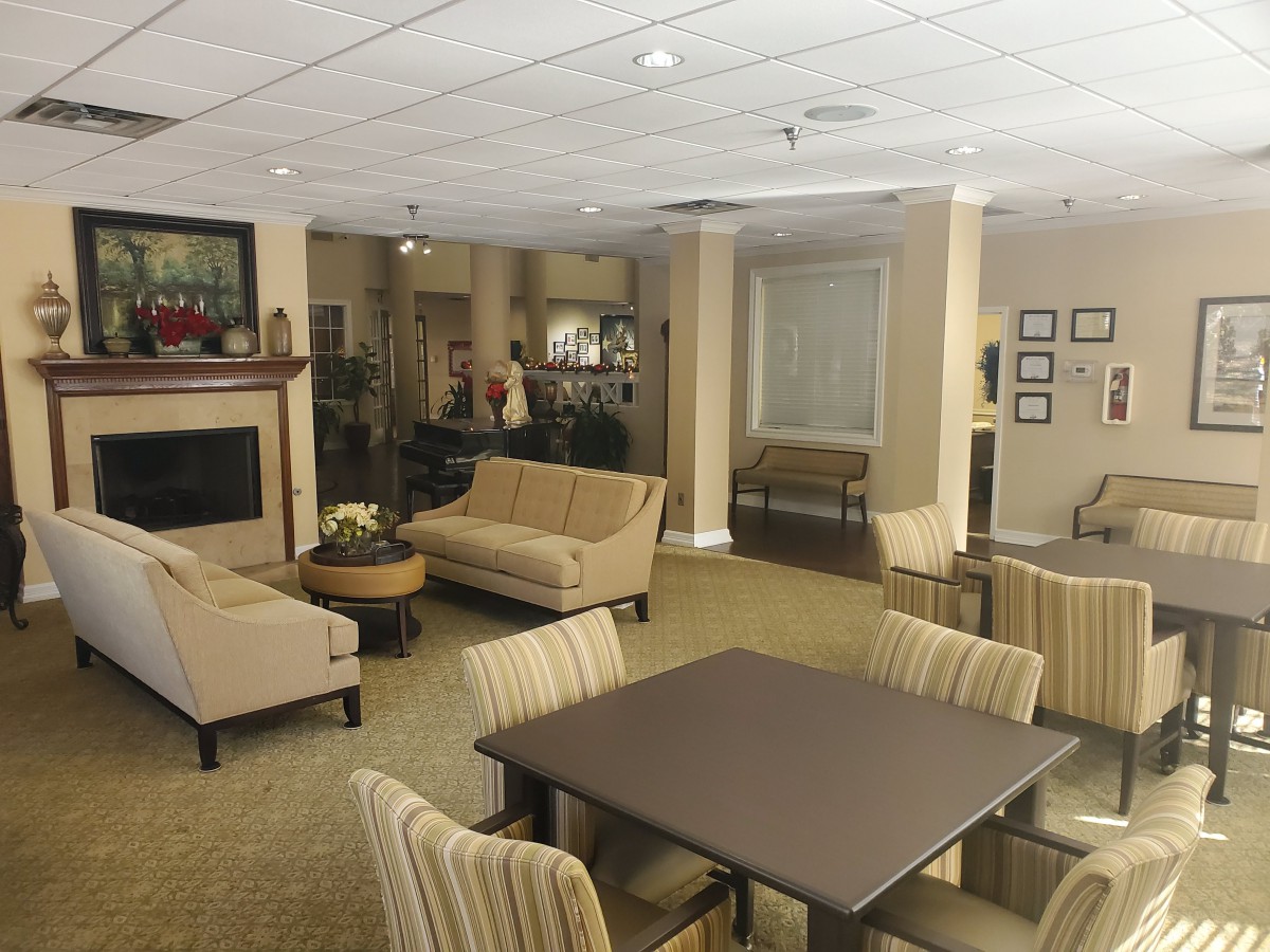 A cozy lounge area with comfortable seating and a fireplace.