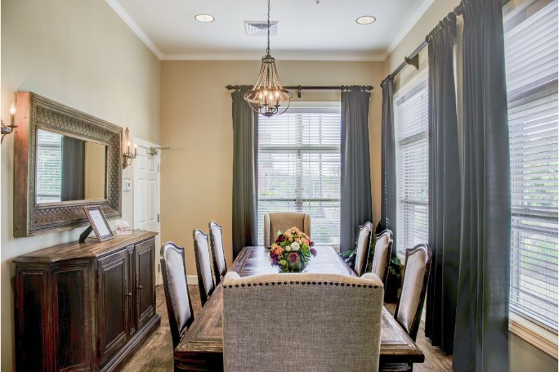 A well-appointed dining room with a large table, elegant chairs, and stylish decor.