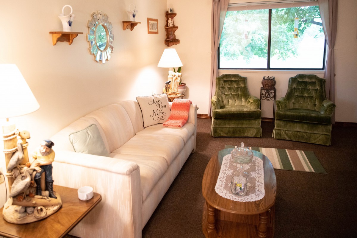 A cozy living room with vintage decor and a comfortable seating area.