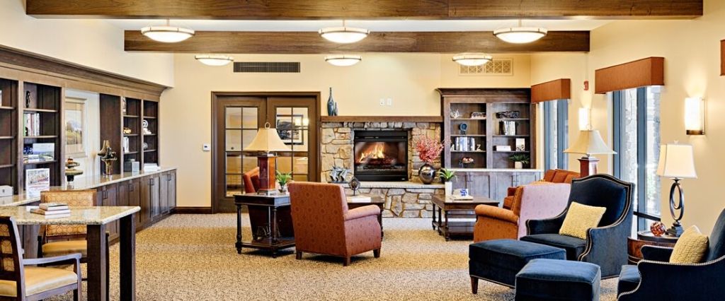 A cozy living room with a fireplace and comfortable seating.