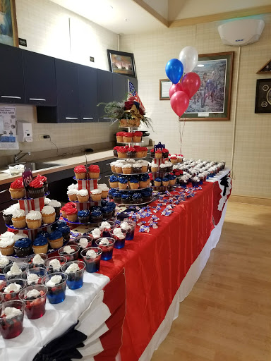 A festive dessert table adorned with red, white, and blue treats, perfect for celebrating a special occasion.