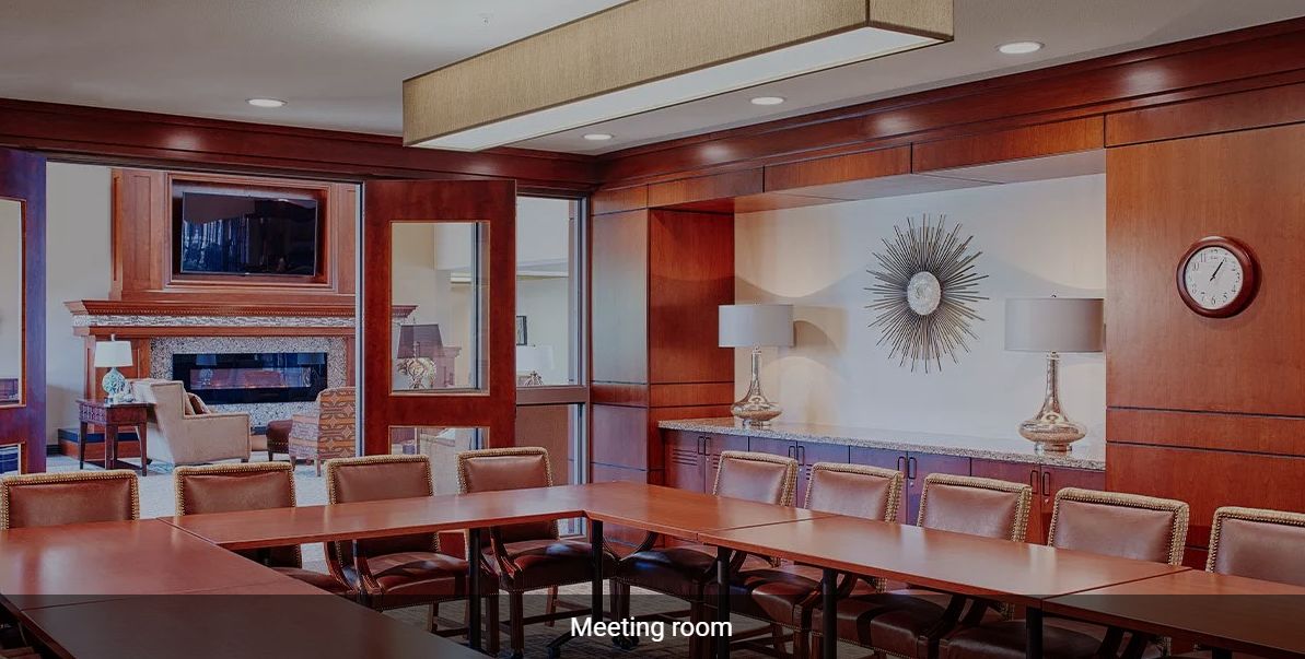 Modern meeting room with conference table and chairs