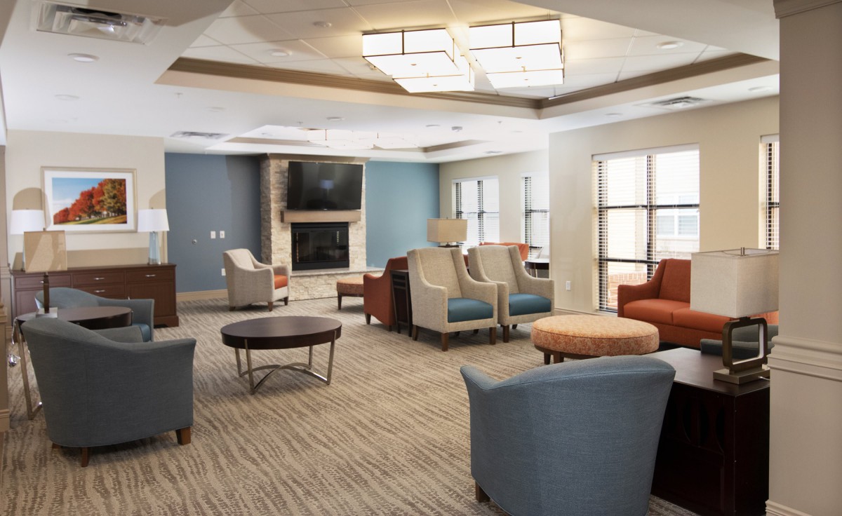 A modern and cozy living room featuring comfortable seating and contemporary design elements.