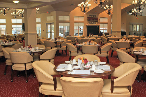 A beautifully designed dining area featuring elegant furniture and soft lighting.
