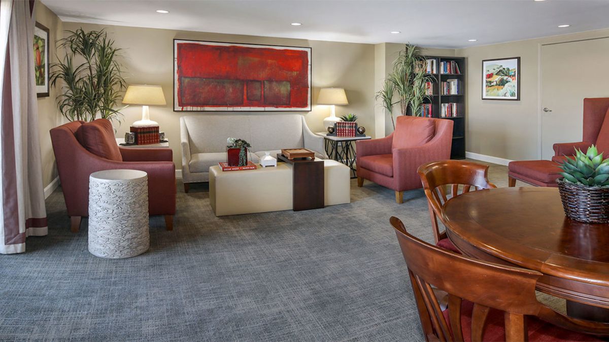 A cozy living room with stylish furniture and modern artwork.