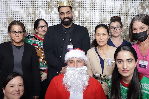 A joyful group celebrating the holiday spirit with Santa Claus.