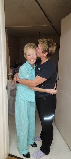 A warm embrace between friends, capturing a moment of joy and affection.
