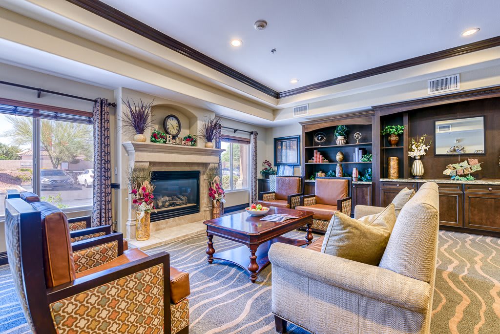 A luxurious and cozy living room with elegant furniture and a fireplace.