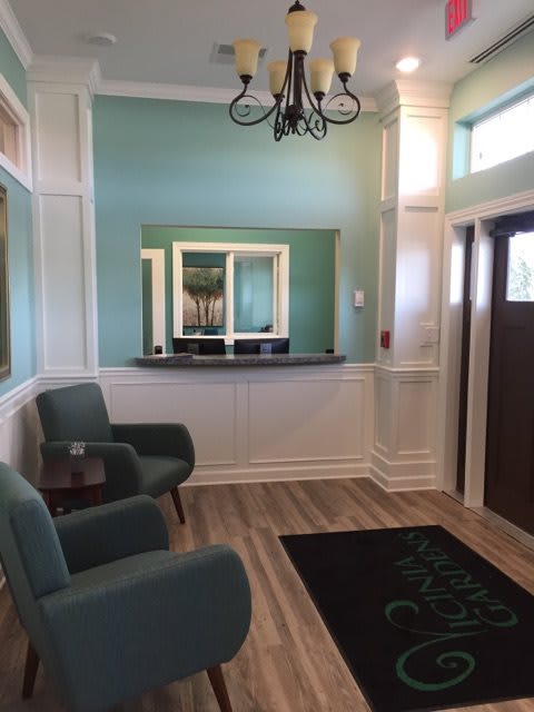 A cozy and stylish waiting room with comfortable chairs and elegant decor.