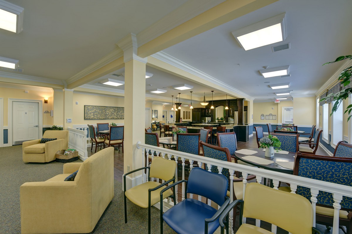 A cozy cafe interior with various seating options and ambient lighting.
