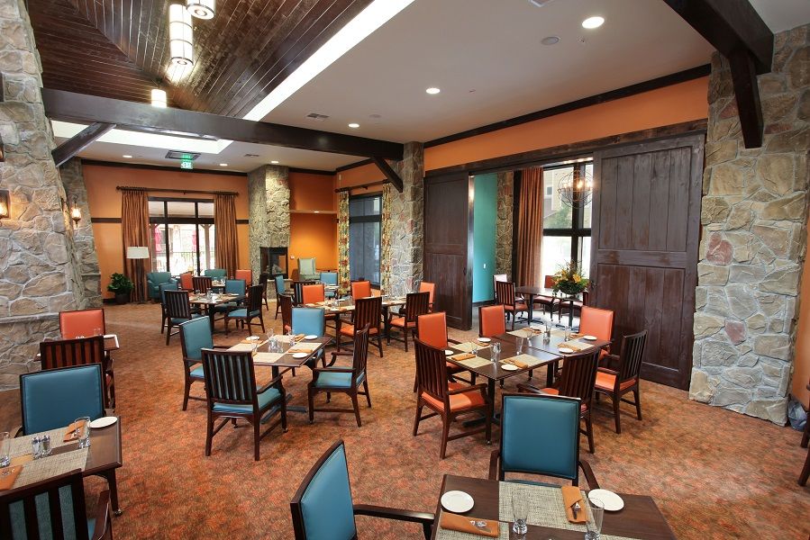 A cozy restaurant dining area with neatly arranged tables and chairs.