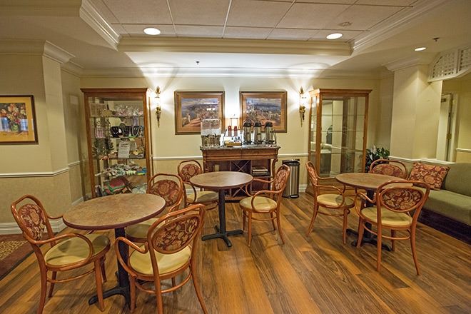 A cozy cafe interior with wooden tables and chairs