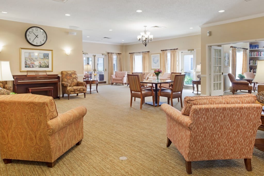 A cozy living room with comfortable seating and elegant decor.