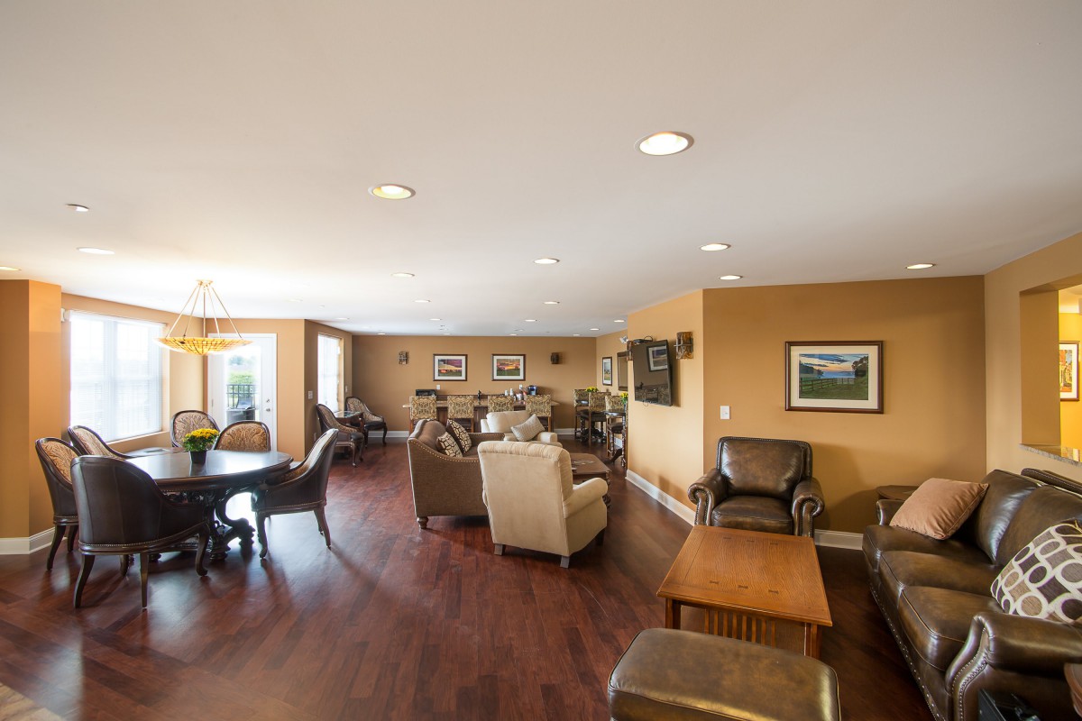 A spacious living room with comfortable seating and hardwood floors.