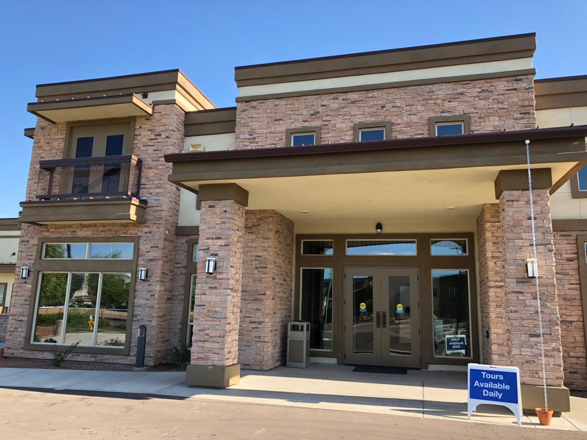 A modern brick commercial building with a prominent entrance.