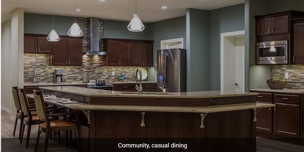 A modern kitchen setup with casual dining space.