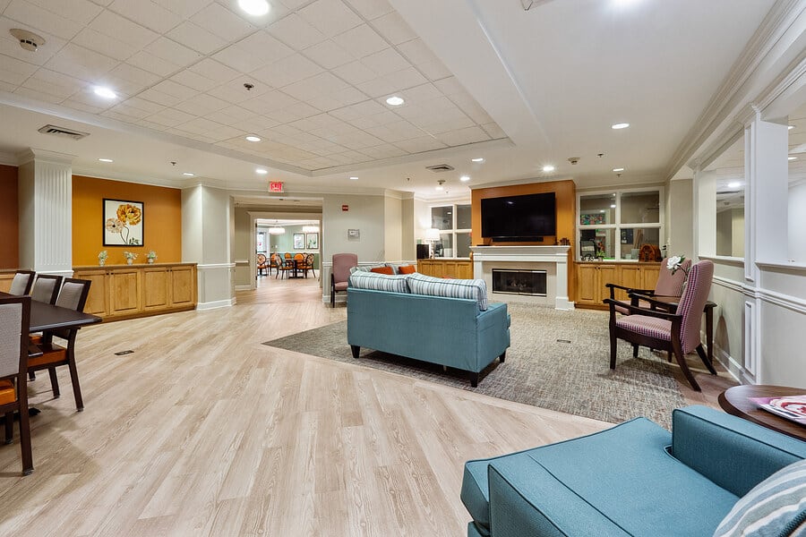 A spacious and modern living room with comfortable seating and a fireplace.