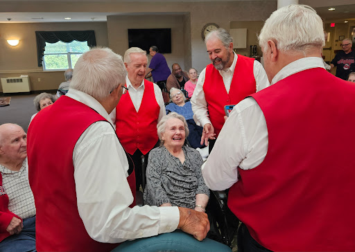 A lively music performance bringing joy to seniors at a community event.