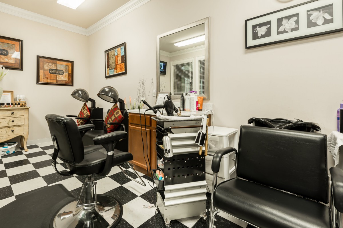A well-organized salon with styling chairs, mirrors, and hair equipment inside.