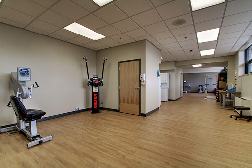 A spacious exercise room equipped for fitness activities.