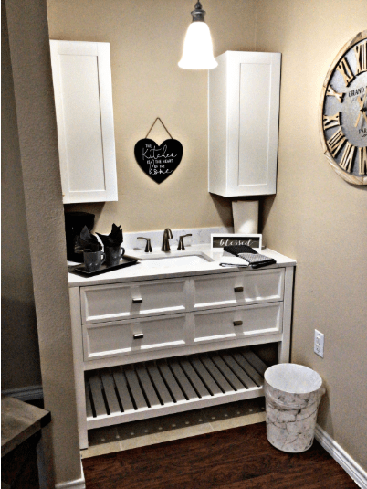 A well-organized bathroom with a white vanity and decorative elements.