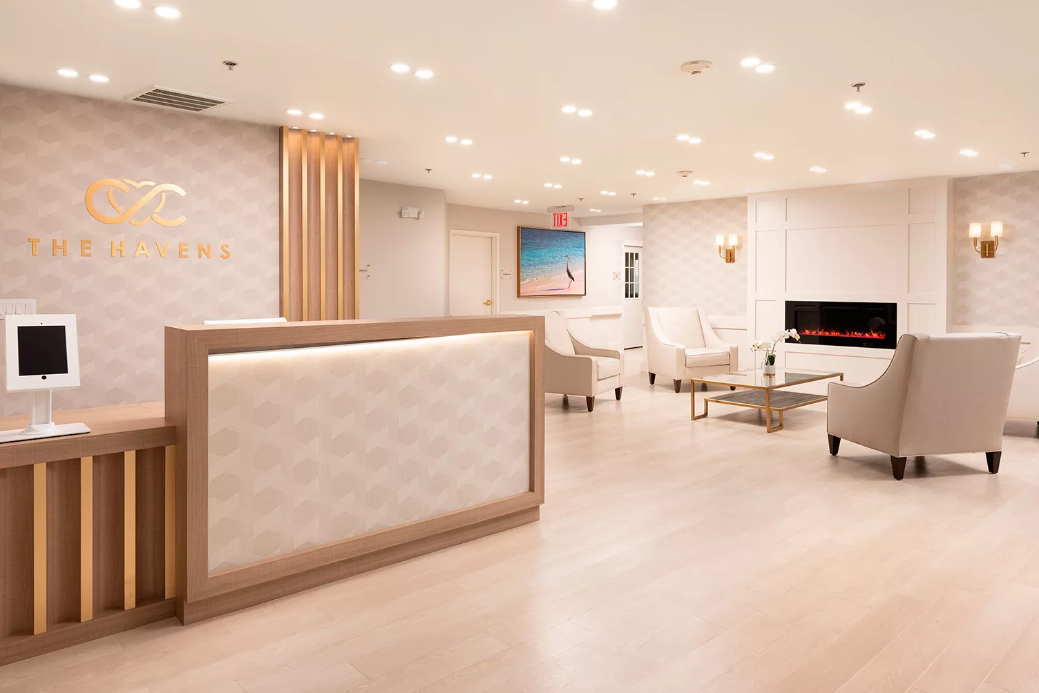 Modern reception area with elegant furniture and bright lighting.