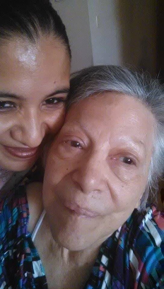 A close-up selfie of two people sharing a moment together.