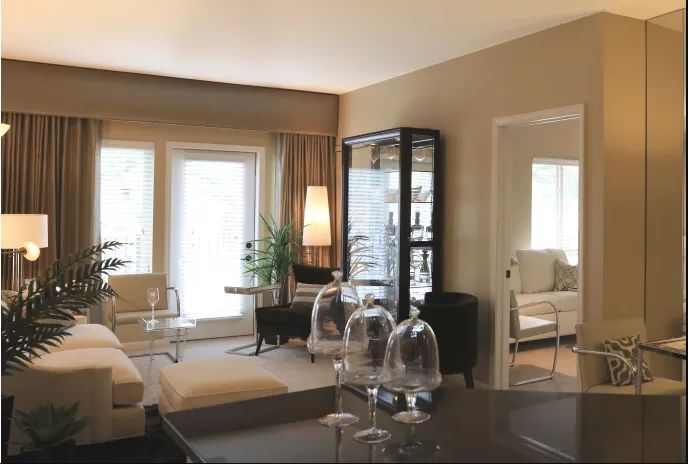 A modern living room with comfortable seating and elegant decor.