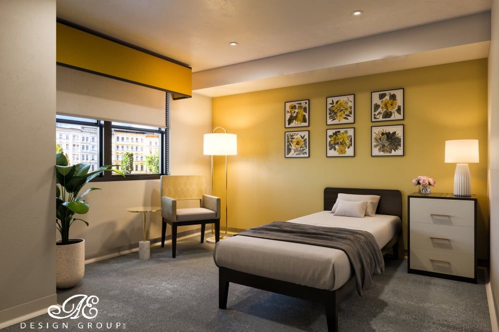 A modern and cozy bedroom with a single bed, featuring yellow walls and contemporary wall art.