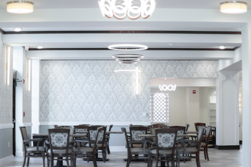 A modern dining area featuring elegant furniture and stylish lighting.