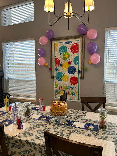 A vibrant birthday celebration setup with colorful decorations and a delightful cake.