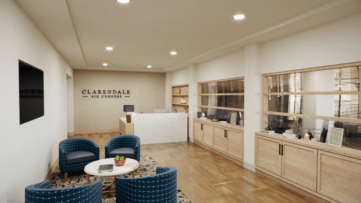 A modern and inviting office reception area with comfortable seating and a sleek desk.