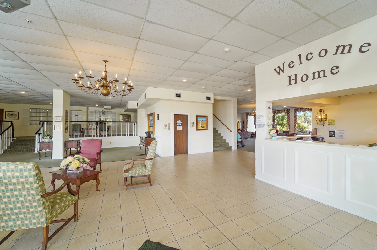 A welcoming hotel lobby with a reception desk and comfortable seating.