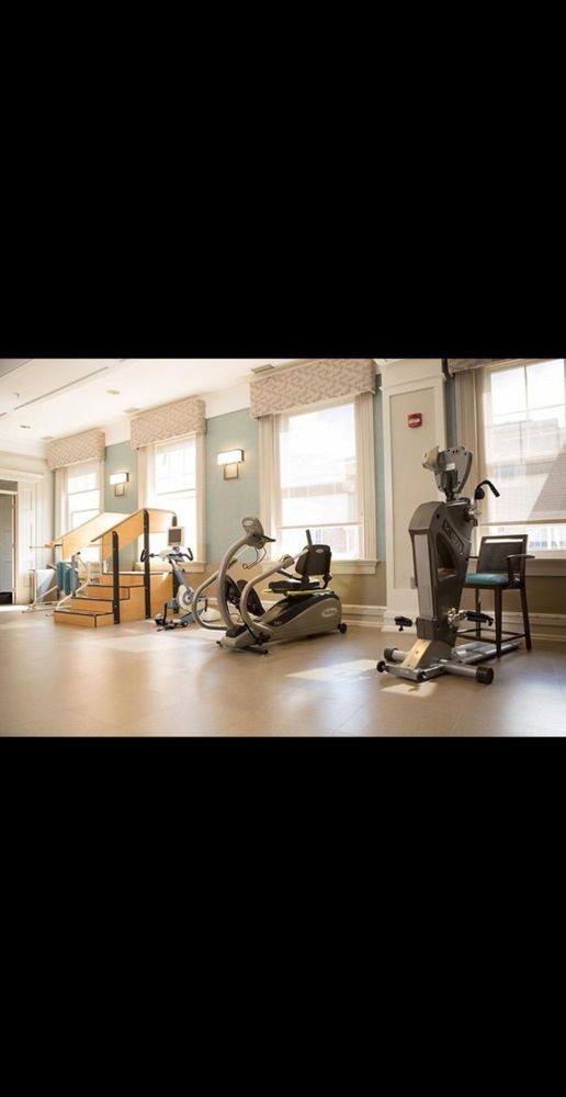 A well-equipped physical therapy room with various rehabilitation machines.