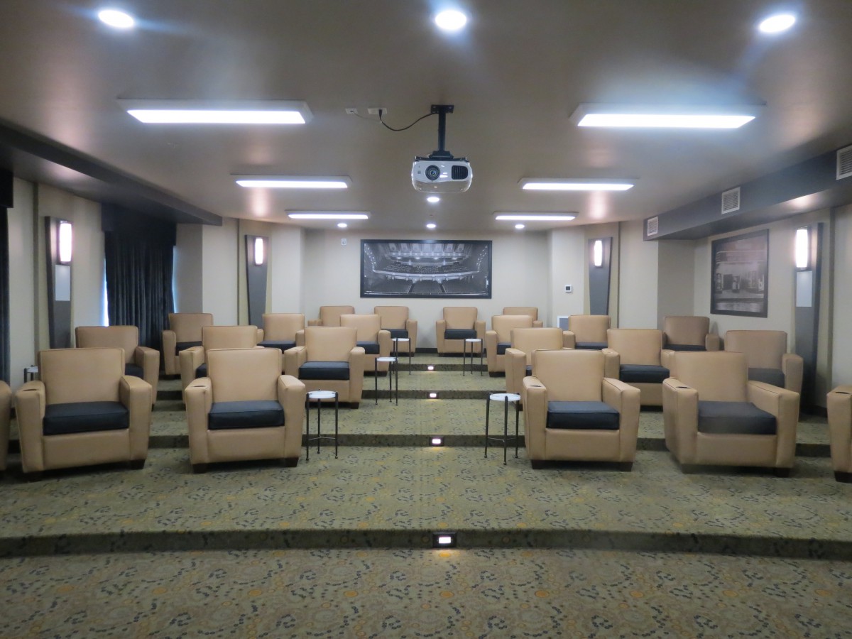 A conference room with arranged seating and a projector for presentations.