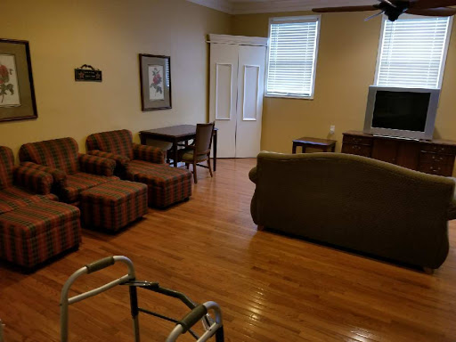 A cozy living room featuring comfortable seating and a warm wooden floor.