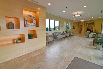 A modern lobby with comfortable seating and decorative elements.