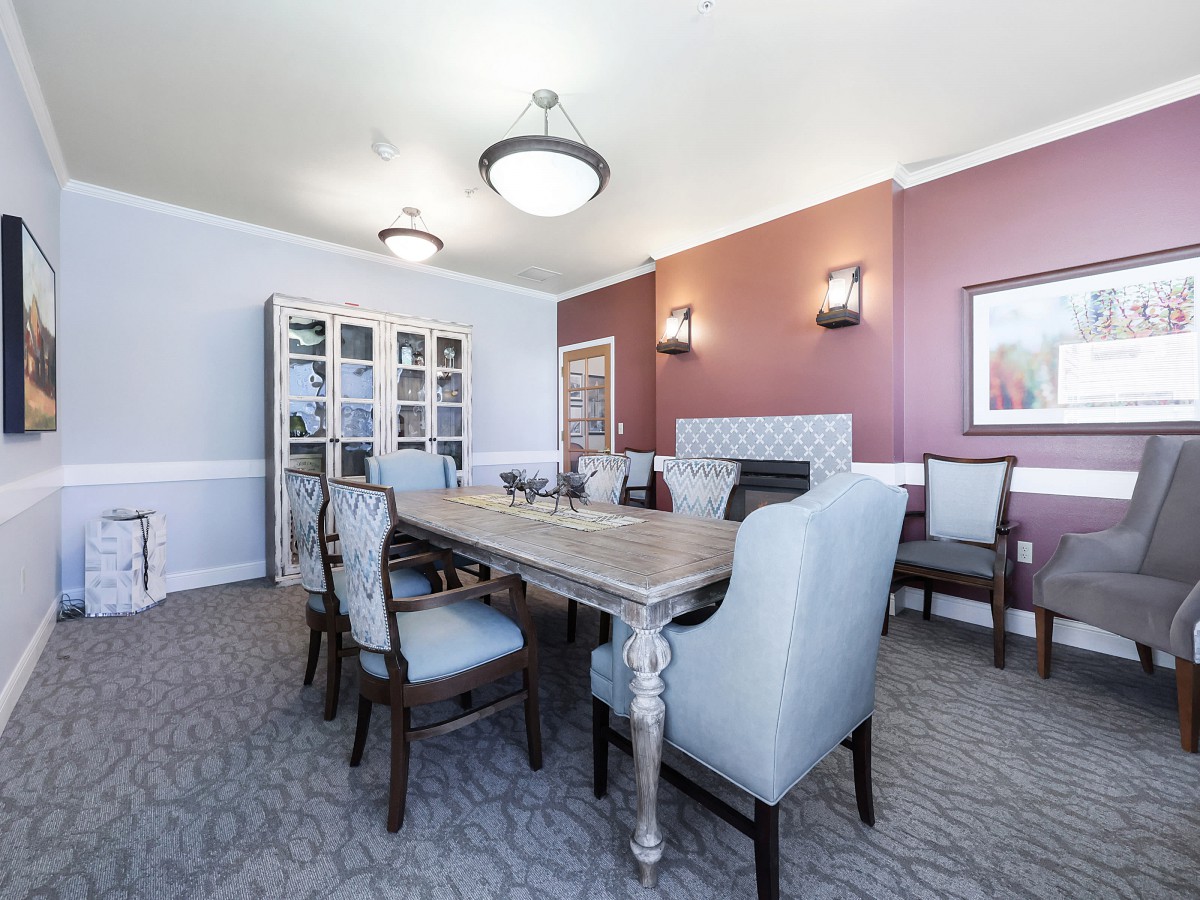 Elegant dining room with modern furniture and stylish lighting.